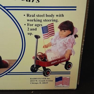 Radio Flyer wagon model and several vintage plush animals