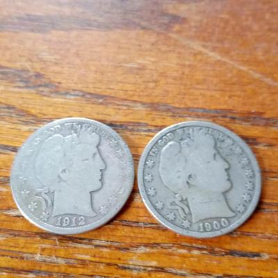LOT 103   TWO OLD SILVER BARBER HEAD HALVES
