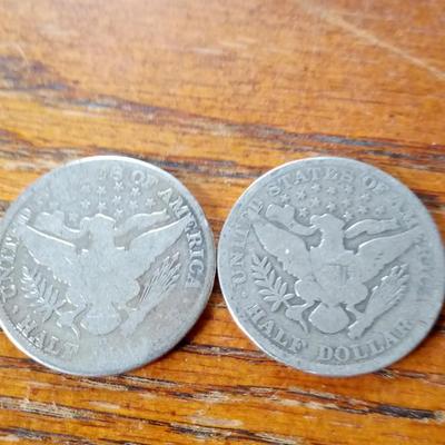 LOT 103   TWO OLD SILVER BARBER HEAD HALVES