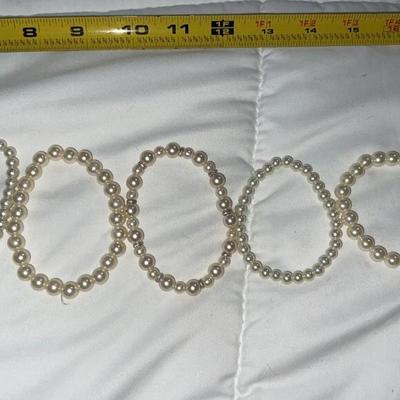 lot of pearl bracelets