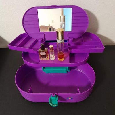 Original Caboodles 3 Tier Makeup Storage Carrying Case with Mirror and bottles of perfume / Cologne.