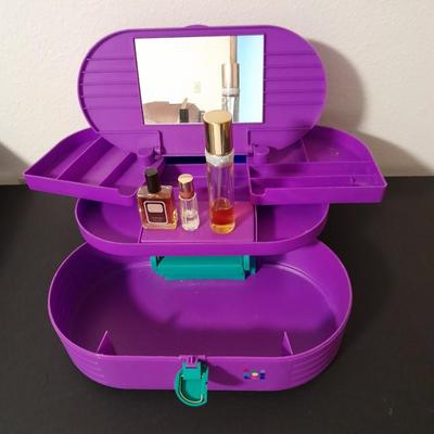 Original Caboodles 3 Tier Makeup Storage Carrying Case with Mirror and bottles of perfume / Cologne.