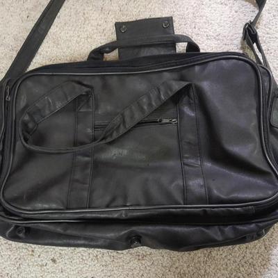 Protool and Luggage, black leather-like case and Samsonite suitcase