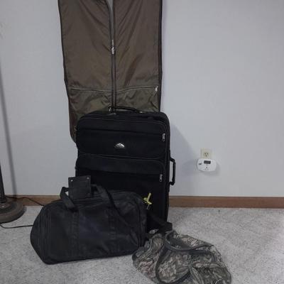 Protool and Luggage, black leather-like case and Samsonite suitcase