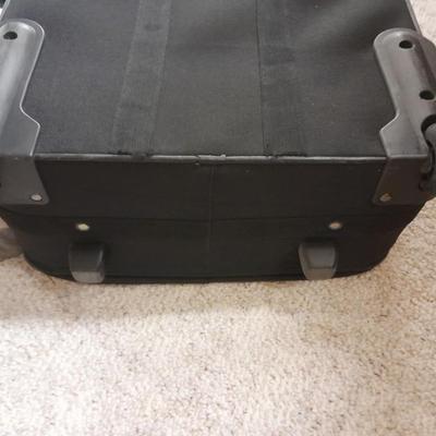 Protool and Luggage, black leather-like case and Samsonite suitcase