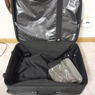 Protool and Luggage, black leather-like case and Samsonite suitcase