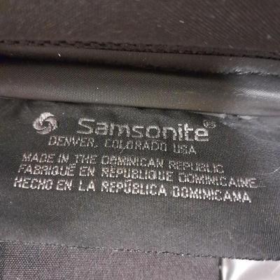 Protool and Luggage, black leather-like case and Samsonite suitcase