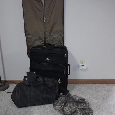 Protool and Luggage, black leather-like case and Samsonite suitcase