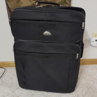 Protool and Luggage, black leather-like case and Samsonite suitcase