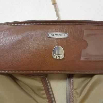 Protool and Luggage, black leather-like case and Samsonite suitcase