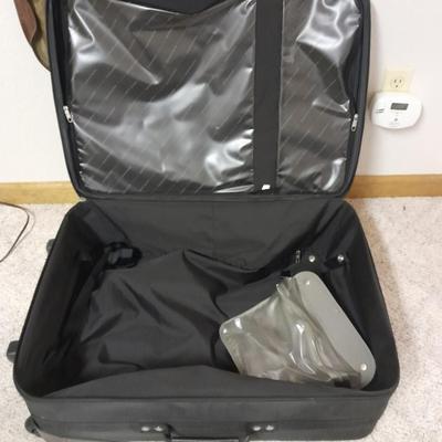 Protool and Luggage, black leather-like case and Samsonite suitcase