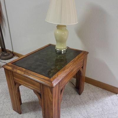 Glass top end table with Inlayed wicker design and a Lamp