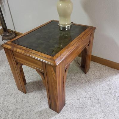 Glass top end table with Inlayed wicker design and a Lamp