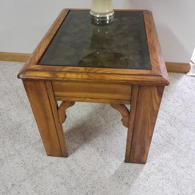 Glass top end table with Inlayed wicker design and a Lamp