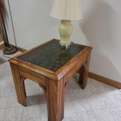 Glass top end table with Inlayed wicker design and a Lamp