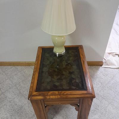 Glass top end table with Inlayed wicker design and a Lamp
