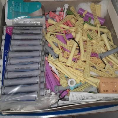 Box of hair curlers, nail care kit, soaps, lotions, Kleenex, perfumes, and brass bathtub soap holder