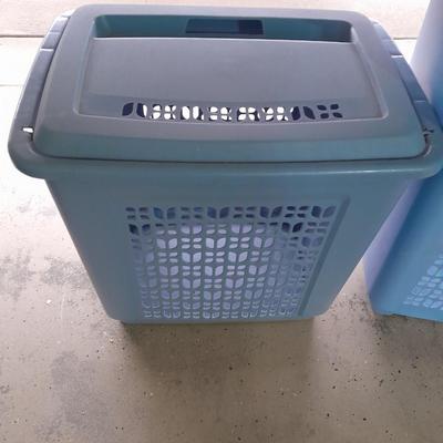 Two blue laundry hampers Garage