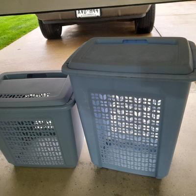 Two blue laundry hampers Garage