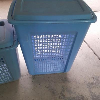 Two blue laundry hampers Garage