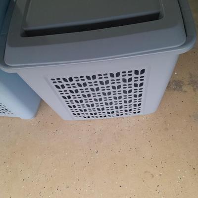 Two blue laundry hampers Garage