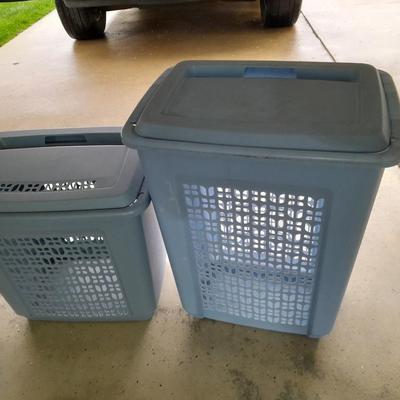 Two blue laundry hampers Garage