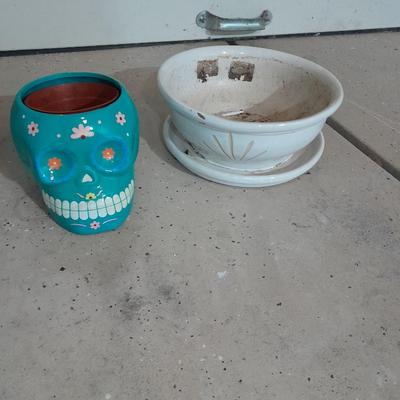Several decorative flower / plant pots and small roll of tree wrap
