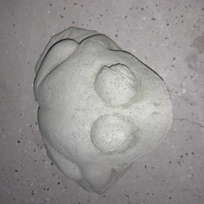 Two small cement garden / pond frogs and a happy toad