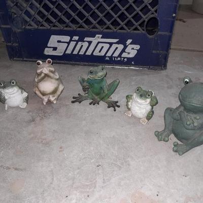Collection of small yard & garden frogs in a milk crate