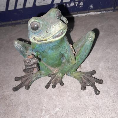 Collection of small yard & garden frogs in a milk crate