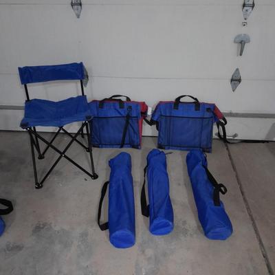 Four folding portable chairs and two stadium seat cushions
