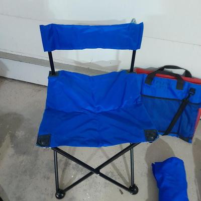 Four folding portable chairs and two stadium seat cushions