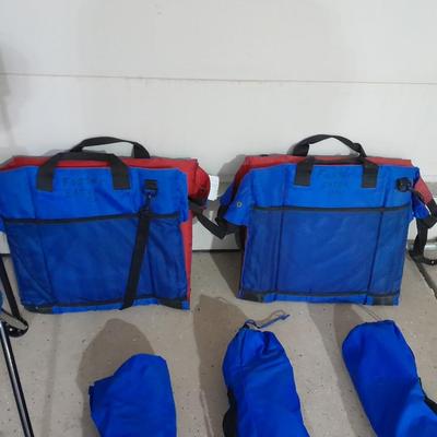 Four folding portable chairs and two stadium seat cushions