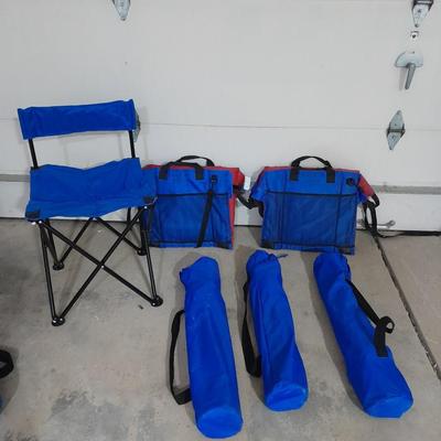 Four folding portable chairs and two stadium seat cushions