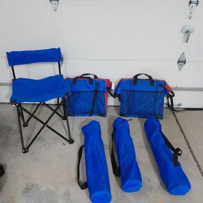 Four folding portable chairs and two stadium seat cushions