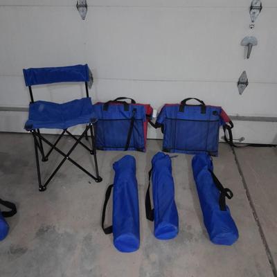 Four folding portable chairs and two stadium seat cushions