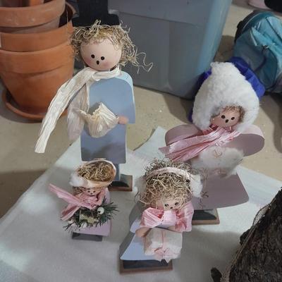Christmas decorations, scented brooms, log candles, standing deer Carolers and more.