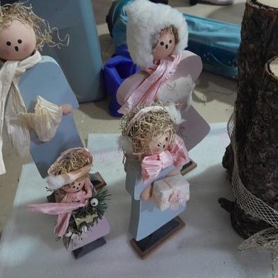 Christmas decorations, scented brooms, log candles, standing deer Carolers and more.