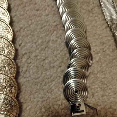 Women's decorative belts, leather with hole studs, concho belts, and silver metal like belt