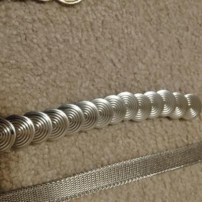 Women's decorative belts, leather with hole studs, concho belts, and silver metal like belt