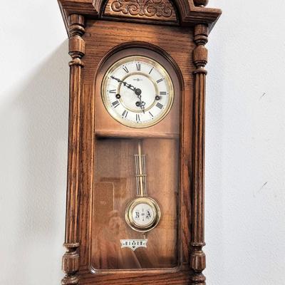 Lot #170  Howard Miller Wall Clock - Good working condition, with key