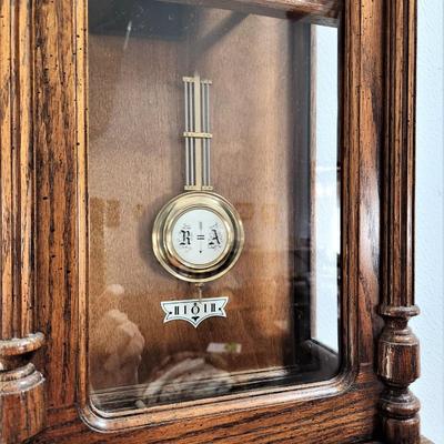 Lot #170  Howard Miller Wall Clock - Good working condition, with key