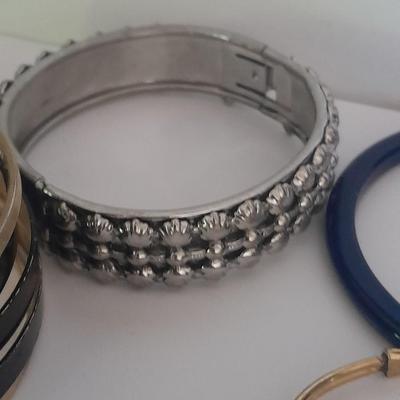 Collection of fun pins and Bracelets