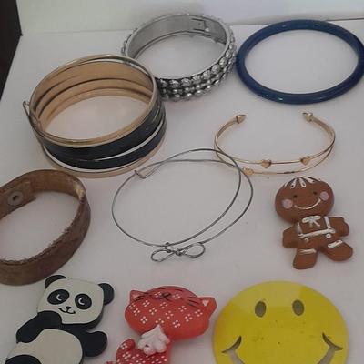 Collection of fun pins and Bracelets