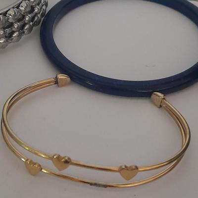 Collection of fun pins and Bracelets