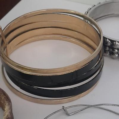 Collection of fun pins and Bracelets