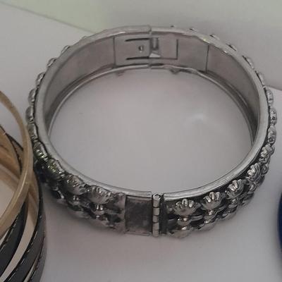 Collection of fun pins and Bracelets