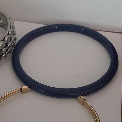 Collection of fun pins and Bracelets