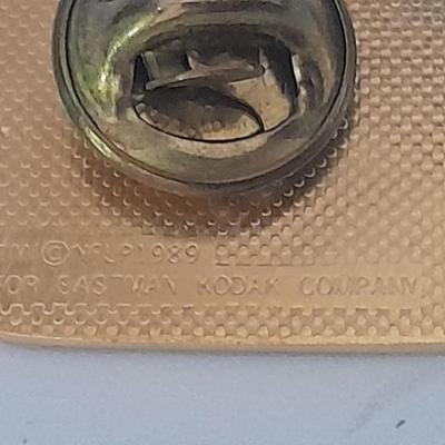 Denver Bronco's cuff links, Bronco's Kodak official film of NFL hat pin, and a black leather wallet