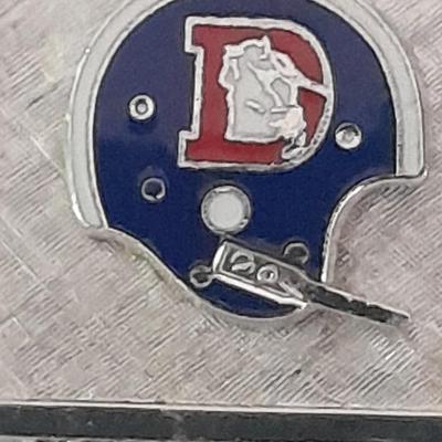 Denver Bronco's cuff links, Bronco's Kodak official film of NFL hat pin, and a black leather wallet